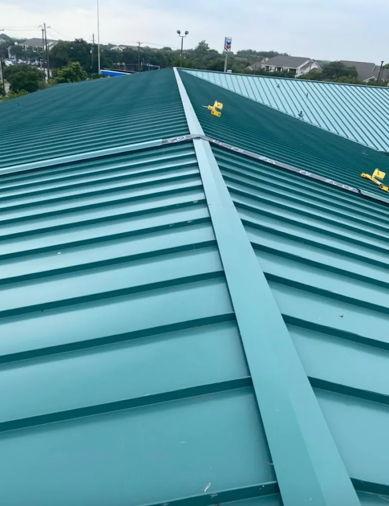 Green commercial metal roof ridge and valley for Metal Roof Repair in Bartlesville