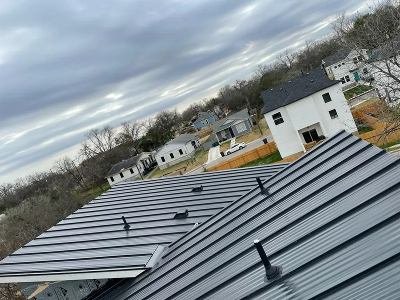 Standing seam metal roof panels with vents for Skylight Repair in Bartlesville